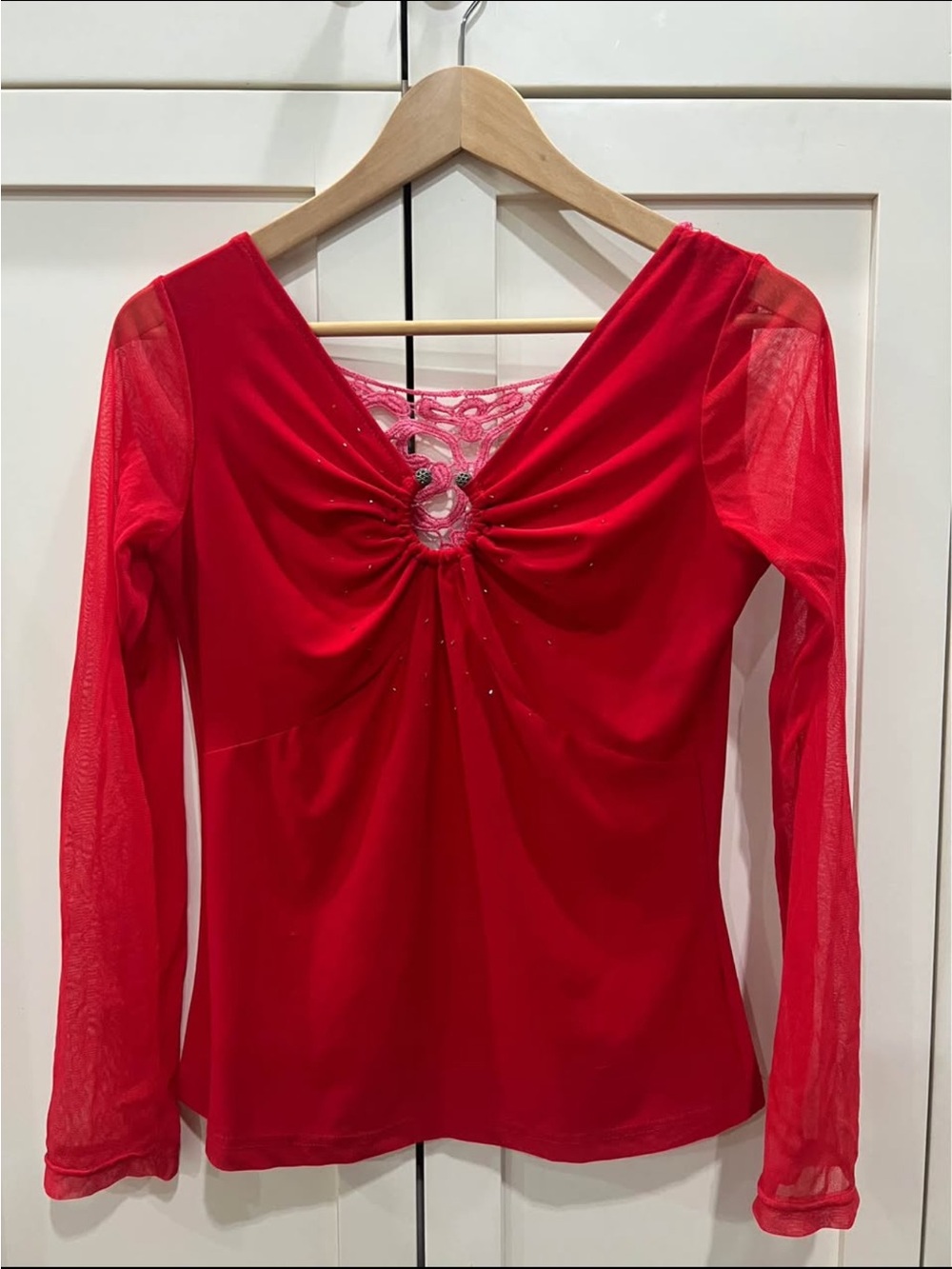 Chic red top with mesh sleeves and rhinestone front